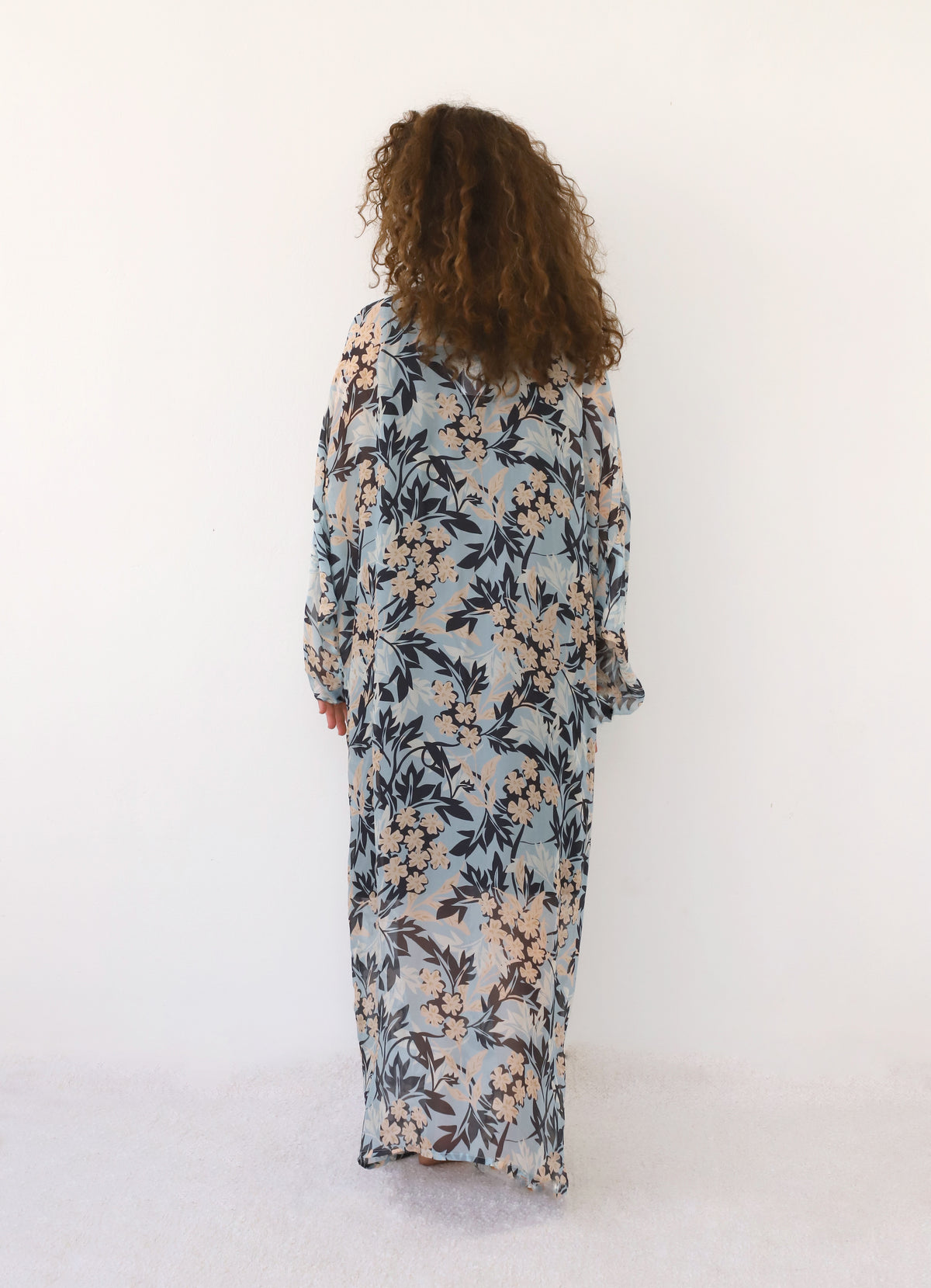 Back view of VVC Italian silk kimono with blue floral print, long handmade silk layer for elegant resort wear, travel and slow fashion styling