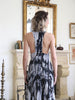 Close-up of T-back detail and concealed zipper on pleated batik dress made in Turkey