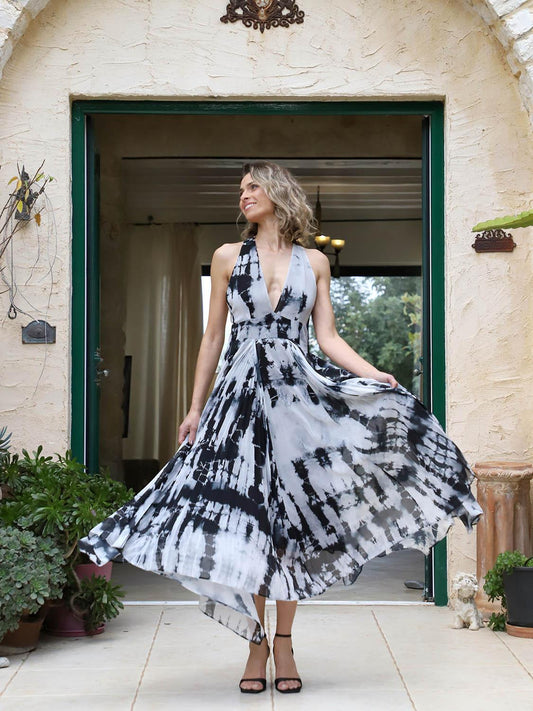 Asymmetrical pleated batik dress with deep V-neckline and A-line silhouette, front view