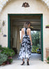 Back view of asymmetrical batik dress featuring elegant T-back design and slim-fit waist