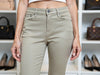 Close-up of griullo skinny-fit trouser — front pocket and fabric texture, laminated finish