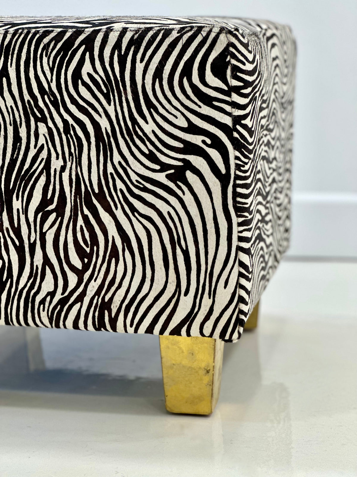 Detailed close-up of cowhide leather side seam on white background