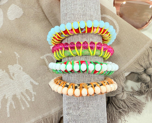 Stack of colorful beaded bracelets by Dimitriadis 