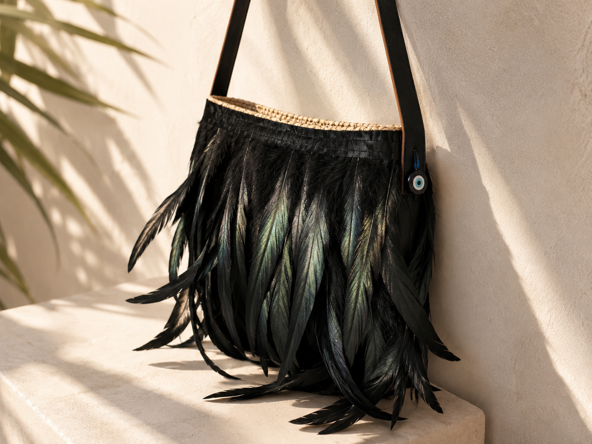 VVC™ black feather shoulder bag in a 2026 luxury boho lifestyle setting, perfect for holidays, resort wear and everyday elegance in Greece.