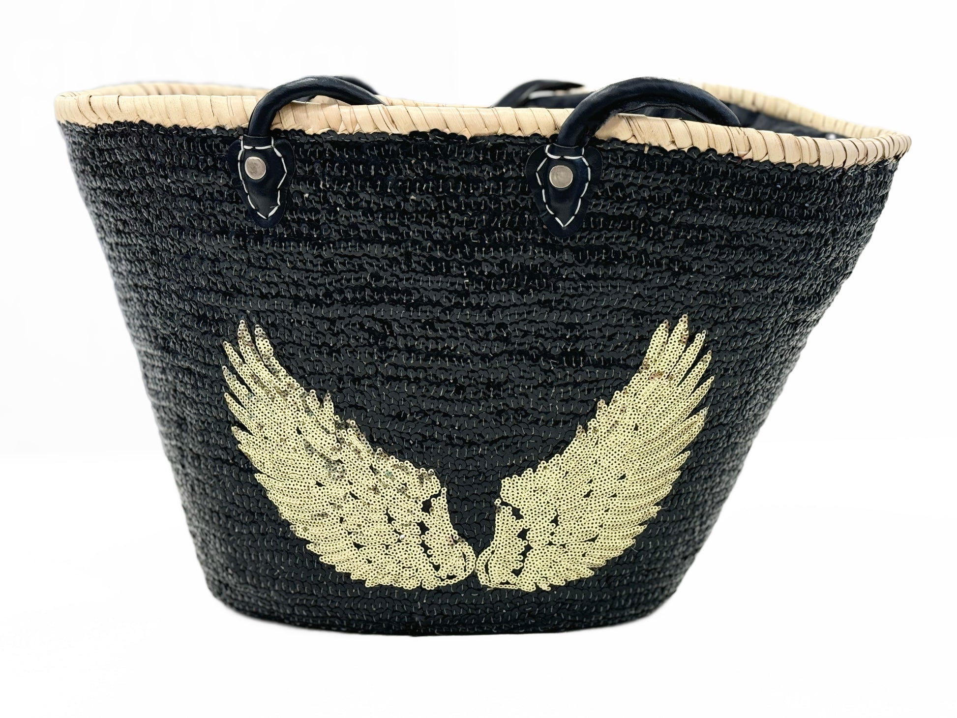 Large handmade black raffia beach and shopping basket with sparkling black sequins and gold angel wings, leather handles and drawstring liner, front view on white background, available at VVC Shop Sitia, Crete.