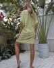 Backview of Green Boho Beach cover up with Zebra Pattern, fringes and Pompom Sitia 