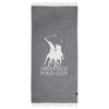A Greenwich Polo Club Pareo Towel in gray with fringes and a visible logo, draped and folded casually.
