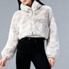 Close-up of a grey cropped faux fur jacket on a white studio background, highlighting the soft texture and detailed faux fur finish.