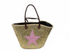 A handmade gold basket beach bag - shopping bag, shoulder bag, tote bag, with a pink sequin star decoration and a brown leather handle.
