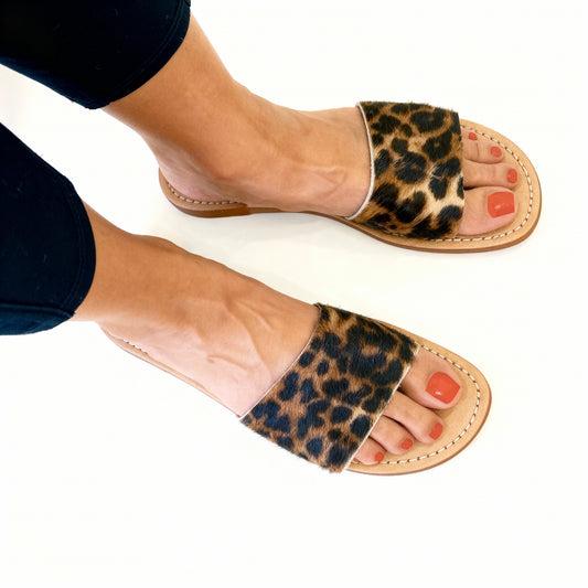 Brown and Black leopard sandals styled as resort and beach outfit at VVC clothing store