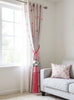Pink curtains with a decorative tassel 