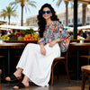Front view of silk-touch poppy flower blouse in blue, loose fit, batwing sleeves, available in Sitia, large sizes 36-46, ideal for big arms