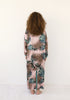 Back view of long pink animal print Italian silk kimono by VVC with tricolor cuffs, styled for an evening look.