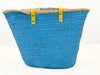 Back Side view of handmade turquoise palm leaf basket with yellow handles and sea star motif, designed for comfortable shoulder carrying.