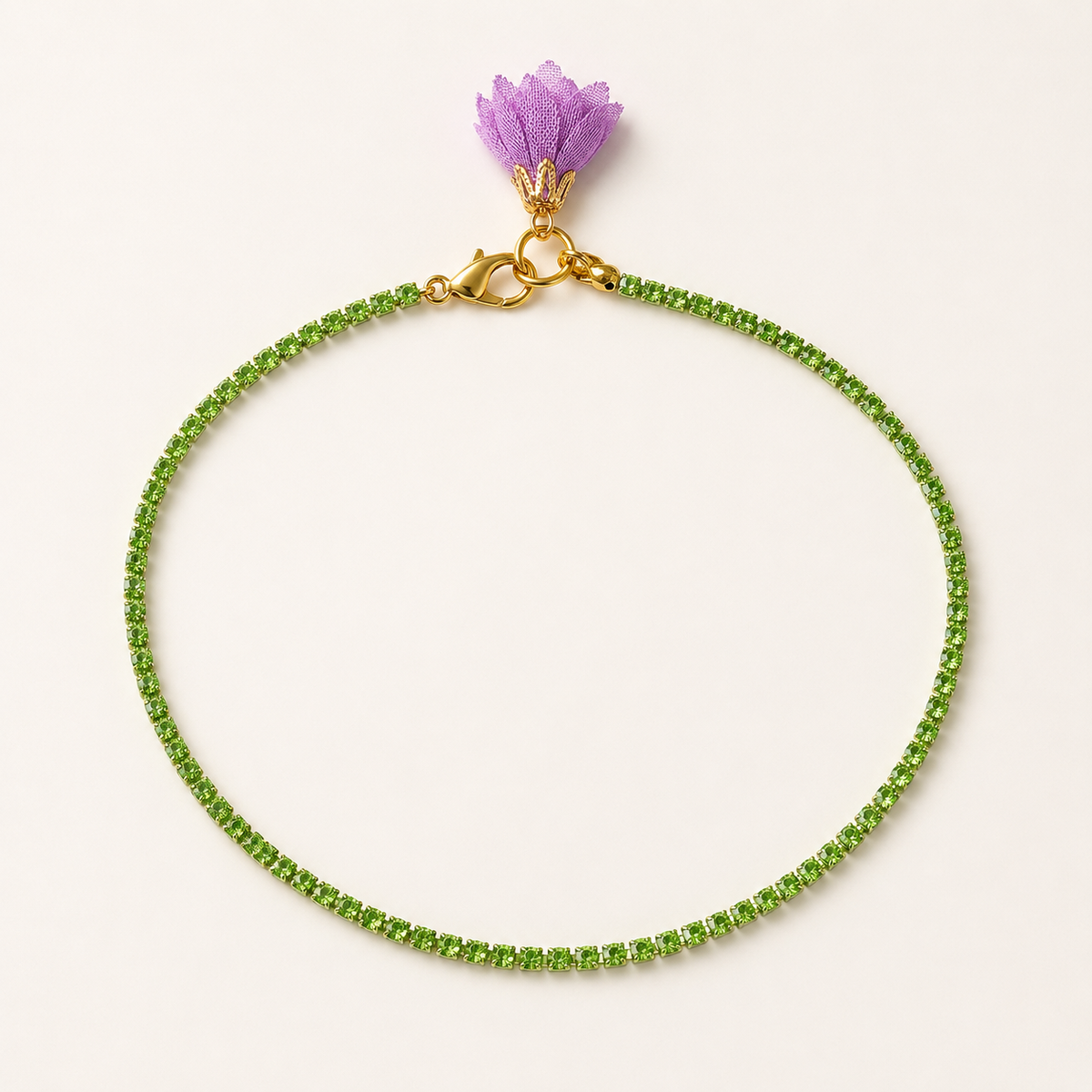 Full view of 40 cm green strass fashion jewellery necklace with purple textile flower, available in Sitia Crete and online at viktoria-vigh.com