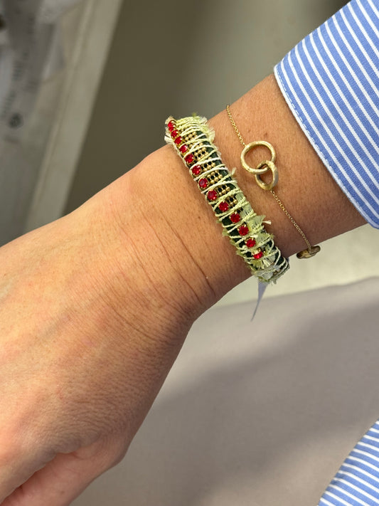 Handmade colorful leather bracelet worn, with golden, red and green clasp by Art Wear Dimitriadis, made in Greece