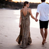 Model wearing leopard tassel dress at Sitia Port boutique setting