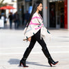 Model 170 cm wearing Angora wool-touch poncho cape in gray, pink, black by Michaela MII, made in Italy.