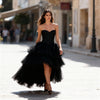 Front view of the Berrin black strapless bandeau bustier top with a straight neckline and fitted silhouette.