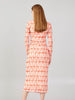 Rear angle of coral patterned midi dress showing clean back lines and art-inspired geometric design.