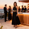 Black gold macramé top worn as a luxury bar terrace outfit with elegant black styling for summer evenings outfit available in Sitia shopping