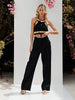 Black gold macramé top styled with black wide-leg trousers for a luxury street look, festival outfit and high-end resort wear at VVC shop Sitia