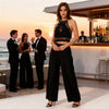 Black gold Melody Macramé Top by Zoe the Label styled with wide-leg trousers for a luxury party look and beach club evening outfit