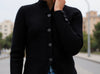 ALT: Close-up of black cardigan button closure and silky soft viscose knit – Made in Italy, VVC Shop Sitia