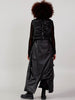 Back view of a women’s black long cardigan vest with subtle sequin detailing and adjustable straps at VVC SHOP Sitia