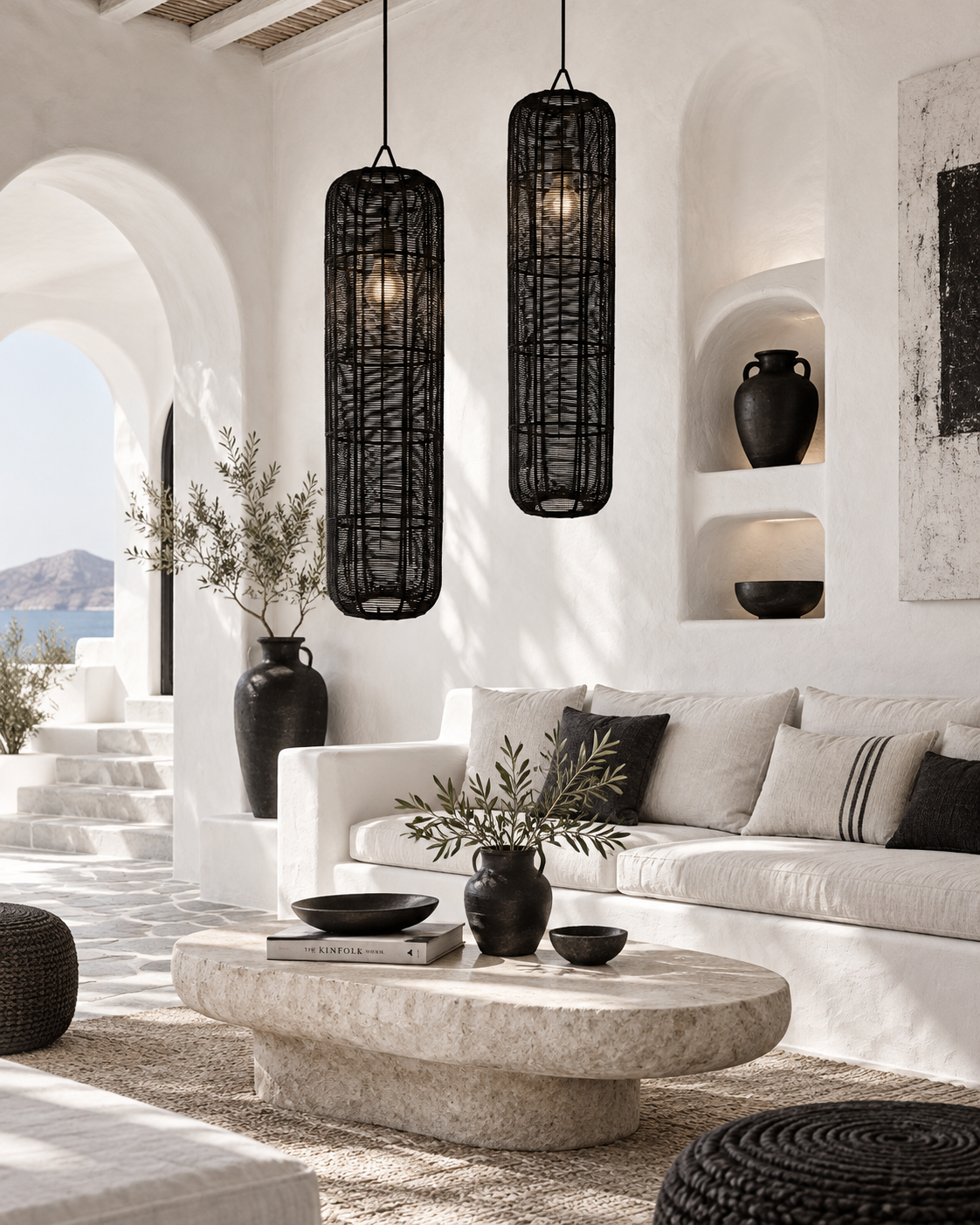 Handmade black cylinder lampshade in a minimal Mediterranean living room with natural textures