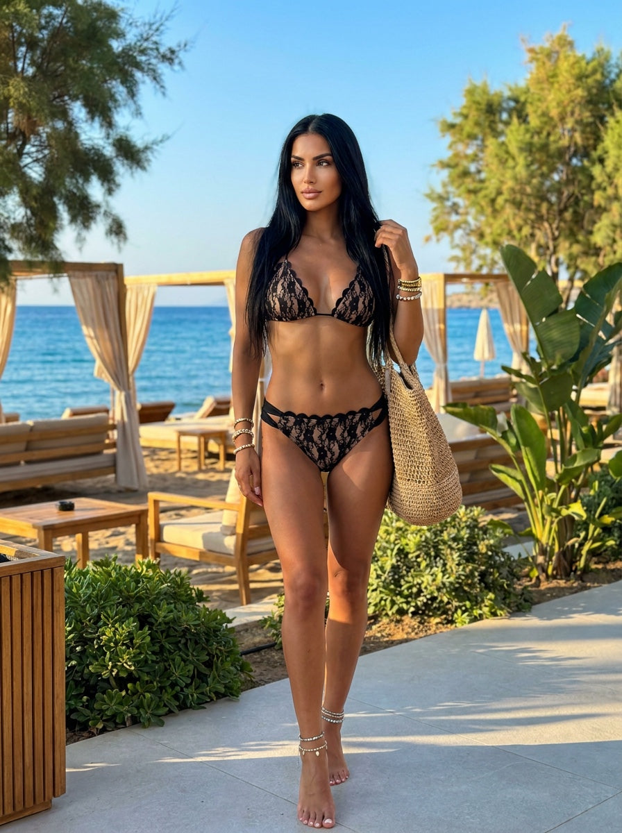 Woman wearing a black and nude floral lace triangle bikini set front view on sale vvc sitia Crete.