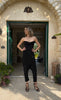 Woman in a black strapless top baptism outfit Sitia 
