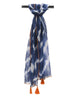 Hanging product view of a blue and white batik scarf with orange fringe at VVC SHOP Sitia.