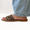 Side view of handmade animal print sandals featuring brown base and dotted pattern, VVC exclusive