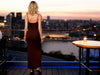Back view of a brown bodycon slim-fit dress showing the fitted silhouette and narrow spaghetti straps.