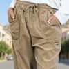 Close-up front view of Camel Brown carrot cut pants showing the adjustable drawstring waist — Made in Italy new arrival at the VVC Shop Sitia and VVC Online Shop.