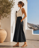 Side view of Caraclan black high-waist palazzo-culotte-pants with slim waist, extra wide leg and ultra-light summer fabric