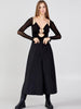 Caraclan black high waist wide-leg palazzo trousers in ultra-light summer fabric, Front view of Caraclan black palazzo-culotte-pants with slim waist, button detail, 3/4 length and extra wide leg