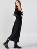 Side walking view of Caraclan black palazzo-culotte-pants, trending 2026 summer style with extra wide leg and relaxed movement