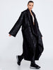 Side view of minimalist long coat with loose fit and soft cotton-blend fabric, Caraclan available at the VVC Shop Sitia, Crete.