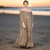 Full-length view of the Civico camel-brown leopard silk-viscose maxi dress in the evening light of Sitia, Crete.