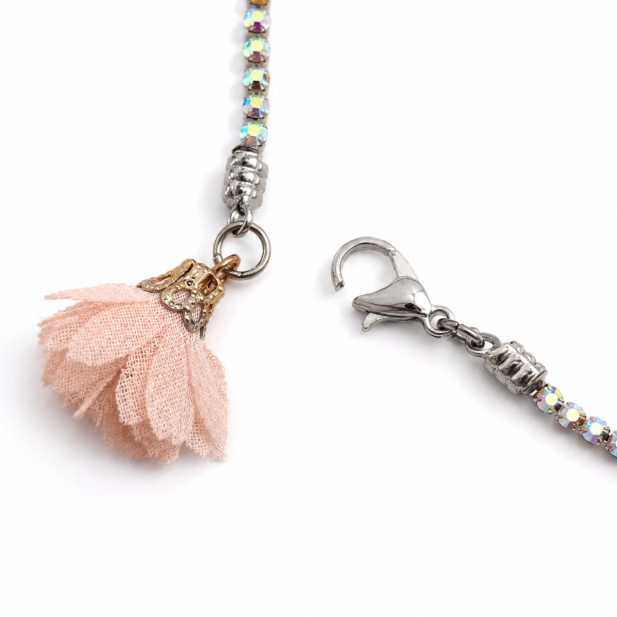 Close-up of the silver-tone clasp and blush textile flower on a rainbow rose-nude rhinestone choker by VVC Shop Sitia.