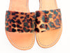 close-up of handmade leather sandals with brown and black leopard print
