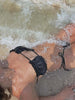 Close-up of the premium fabric and texture of the Diver Luxury Swimwear black bandeau bikini made in Greece.