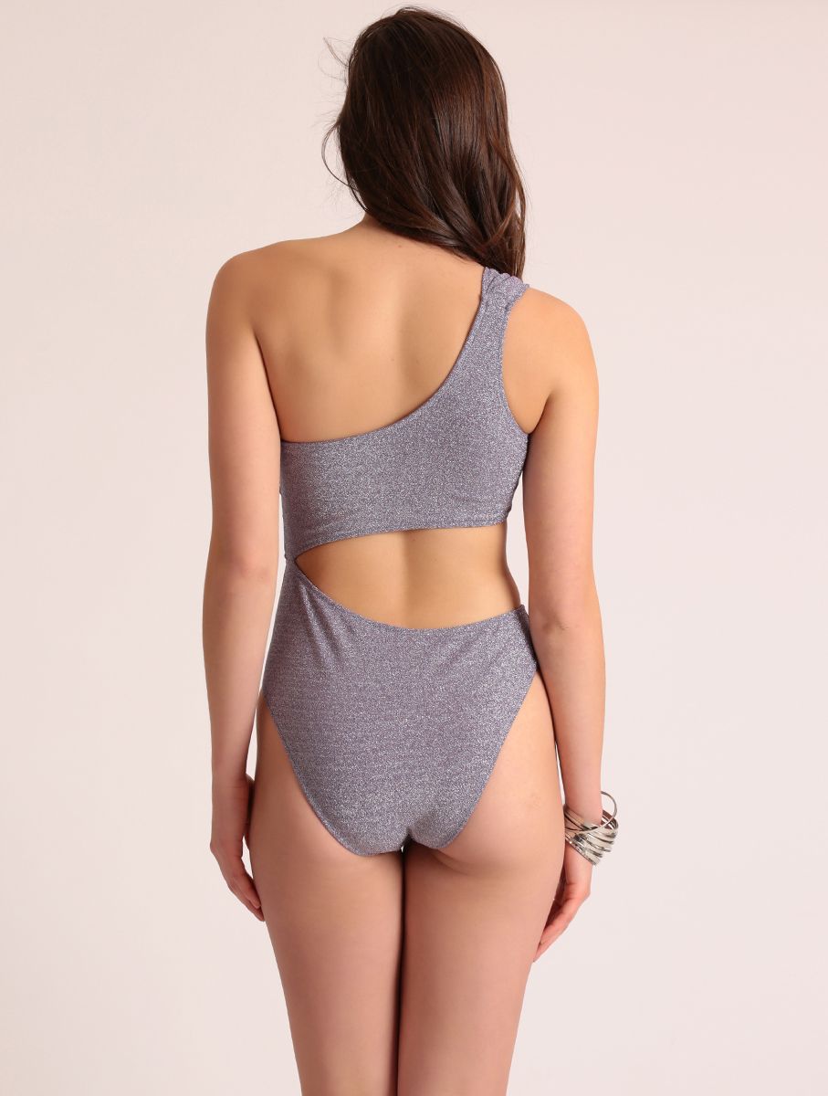 Back view of the Diver Luxury Swimwear purple lurex monokini with asymmetrical one-shoulder strap, shimmer fabric and flattering high-waist fit, made in Greece.