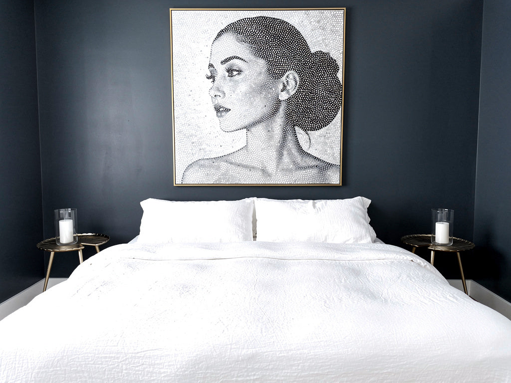 Gold leaf bedside tables beside a white bed in a modern dark blue bedroom, available from VVC SHOP Sitia
