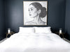 Gold leaf bedside tables beside a white bed in a modern dark blue bedroom, available from VVC SHOP Sitia