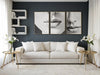 Gold leaf side tables with lilies beside a white sofa in a modern living room, available from VVC SHOP Sitia
