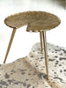 Side view of the Gold Lilly accent table — sculptural design with three legs, small and portable
5