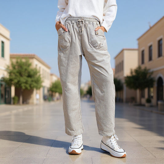 Full front view of Gray Grullo carrot-cut trousers with a relaxed tapered fit, styled at VVC SHOP Sitia, Crete.